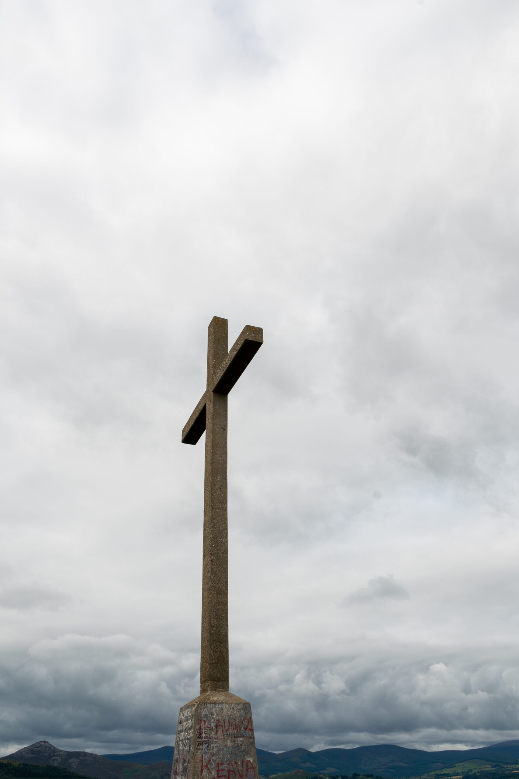Cross standing on top of the hill in Bray Head in Ireland