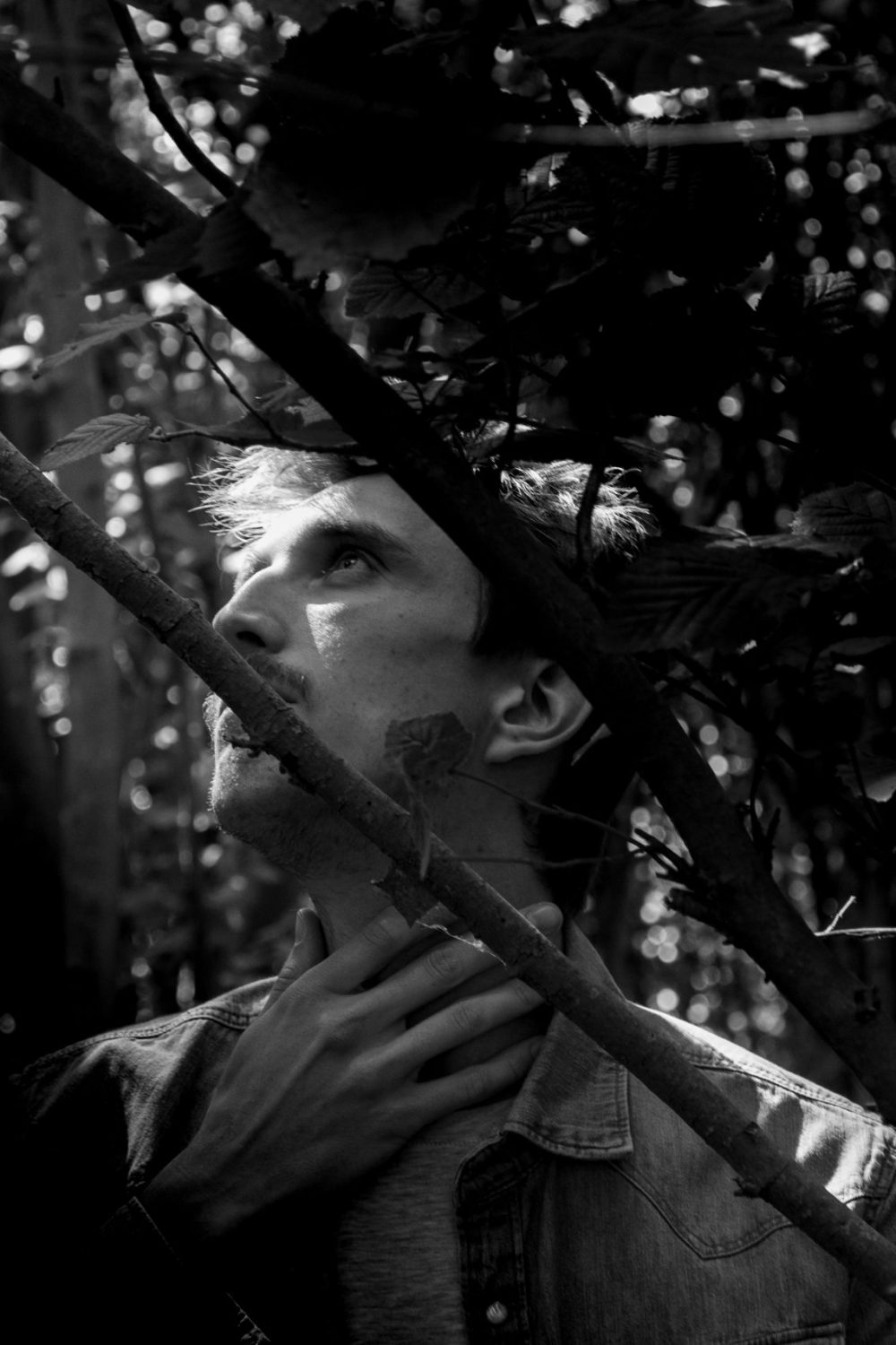 Black and white portrait of a man in nature