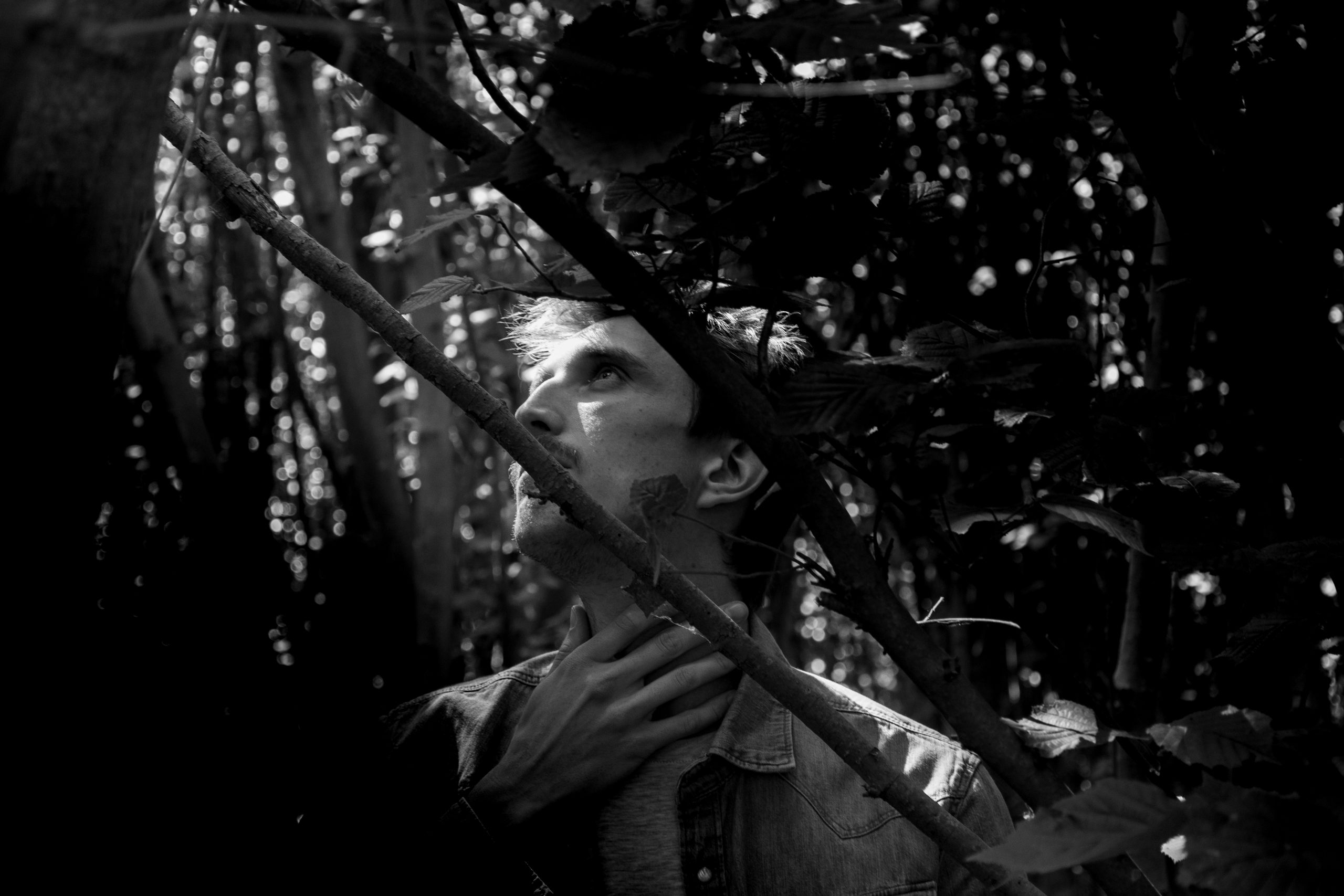 Black and white portrait of a man in nature